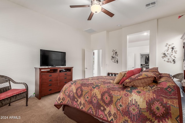 bedroom with ceiling fan and light carpet