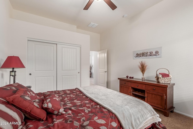 carpeted bedroom with a closet and ceiling fan