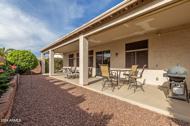 back of property featuring a patio