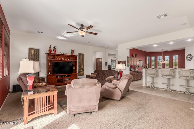 tiled living room featuring ceiling fan