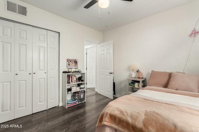 bedroom with ceiling fan, dark hardwood / wood-style floors, and a closet