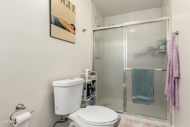 bathroom with toilet and walk in shower