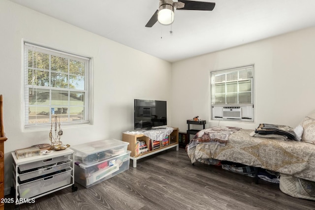 bedroom with ceiling fan and dark wood-type flooring