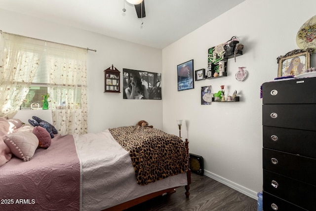 bedroom featuring ceiling fan and dark hardwood / wood-style floors