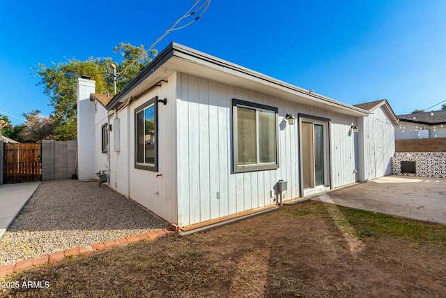 back of property with a patio