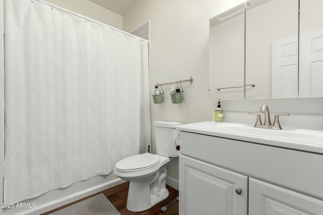 full bathroom with hardwood / wood-style floors, toilet, shower / bath combination with curtain, and vanity