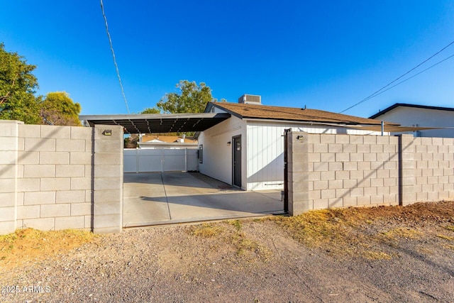 view of property exterior with a carport