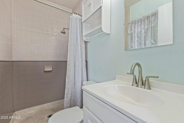 2145 W Cholla St, Phoenix, AZ 85029 - bathroom featuring tiled shower, vanity, and toilet