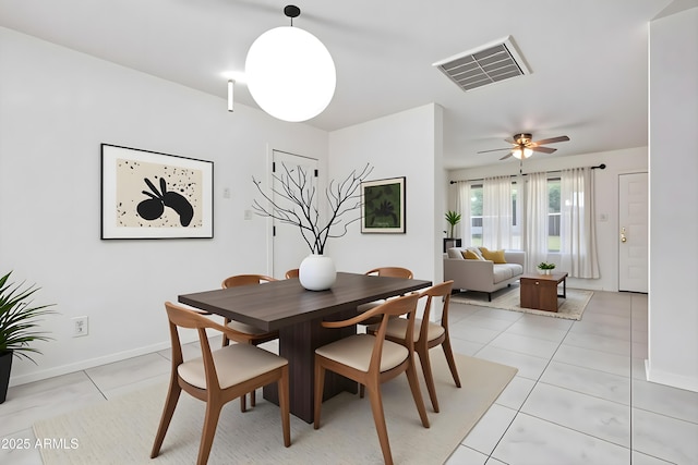 2145 W Cholla St, Phoenix, AZ 85029 - dining space with light tile patterned floors, ceiling fan, and baseboards