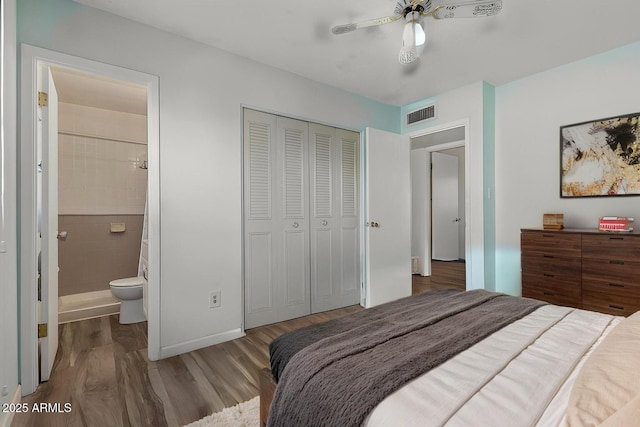2145 W Cholla St, Phoenix, AZ 85029 - bedroom with wood finished floors, a closet, ensuite bath, baseboards, and ceiling fan