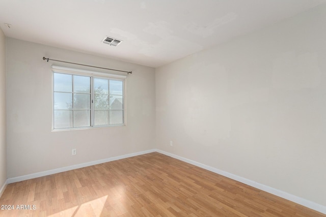 empty room with light wood-type flooring