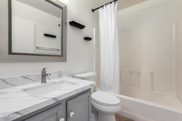 full bathroom with tile patterned flooring, vanity, shower / tub combo, and toilet