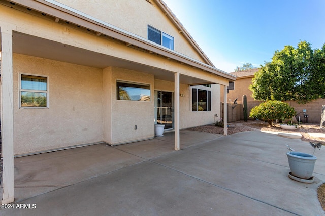 back of property with a patio