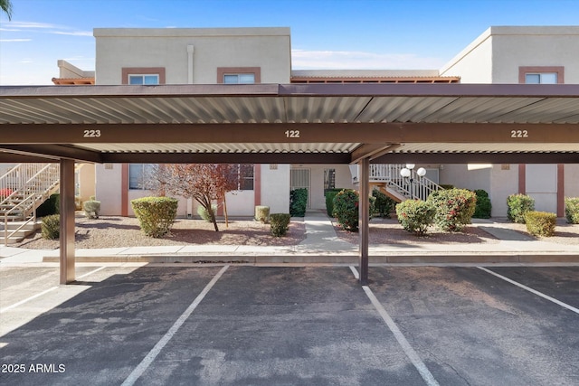 view of parking / parking lot with a carport