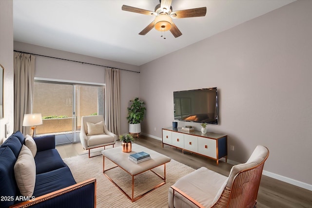 living room with ceiling fan and hardwood / wood-style flooring