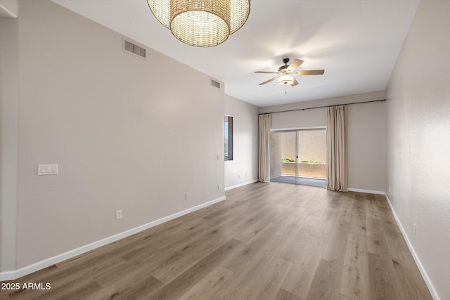 spare room with ceiling fan and light hardwood / wood-style floors