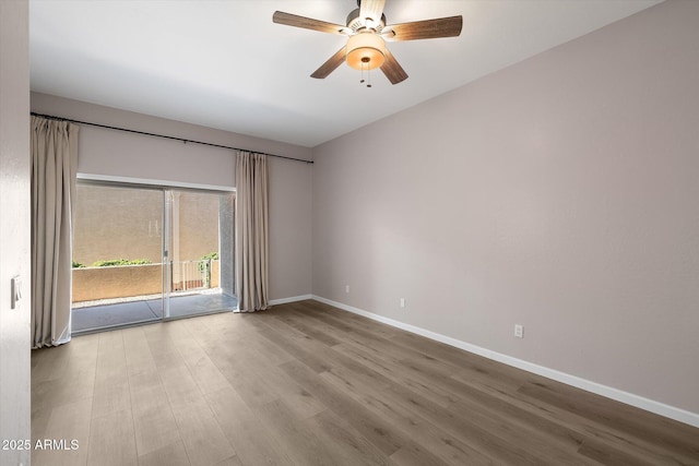 unfurnished room featuring hardwood / wood-style flooring and ceiling fan