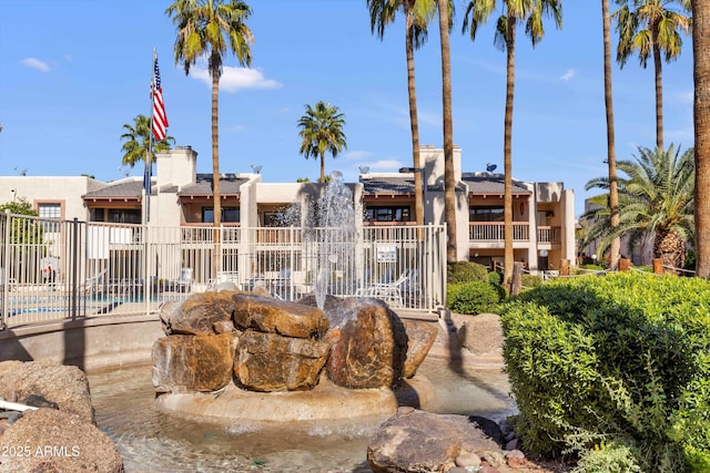 view of property featuring a community pool