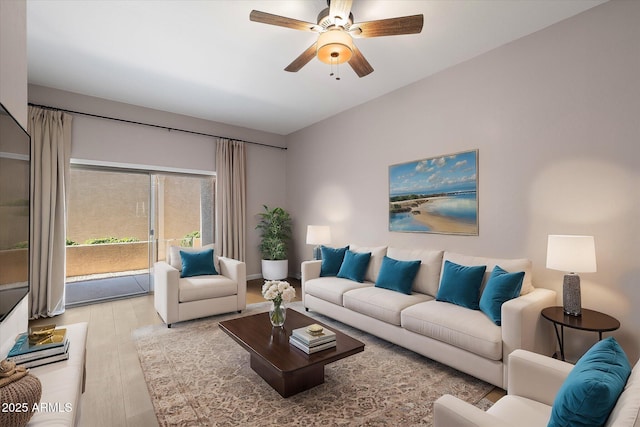 living room featuring ceiling fan and light hardwood / wood-style floors