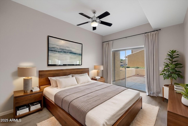 bedroom featuring access to outside, ceiling fan, and hardwood / wood-style floors