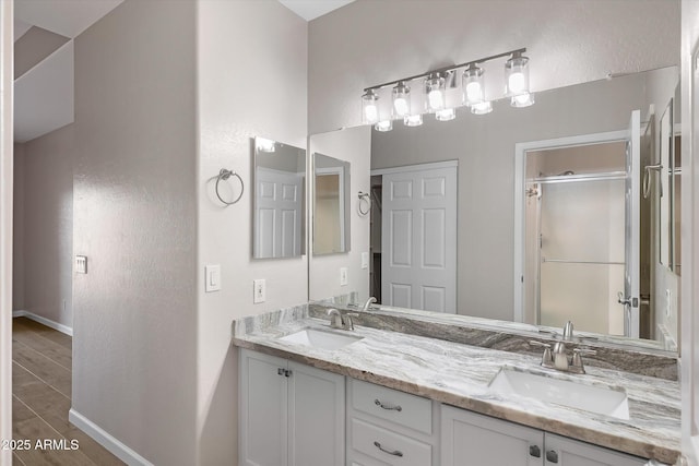 bathroom with wood-type flooring and vanity