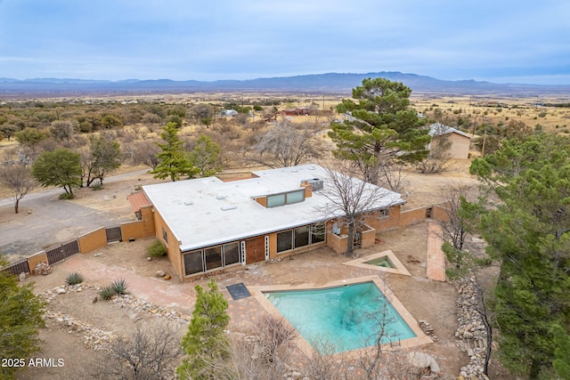 birds eye view of property with a mountain view