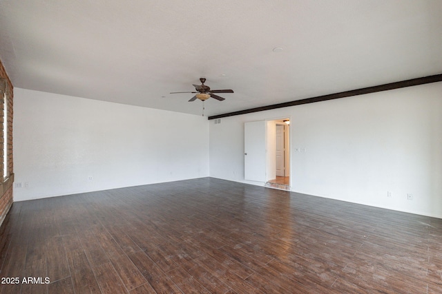 spare room featuring ceiling fan and dark hardwood / wood-style flooring