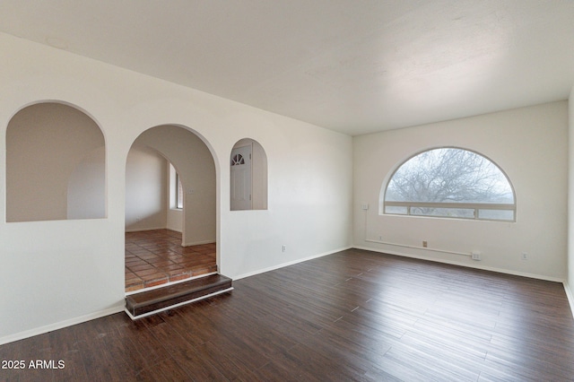 empty room featuring dark hardwood / wood-style floors