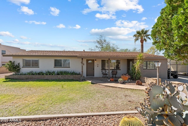 665 W Chaparral Rd, Wickenburg, AZ 85390 - ranch-style house with a front yard and covered porch