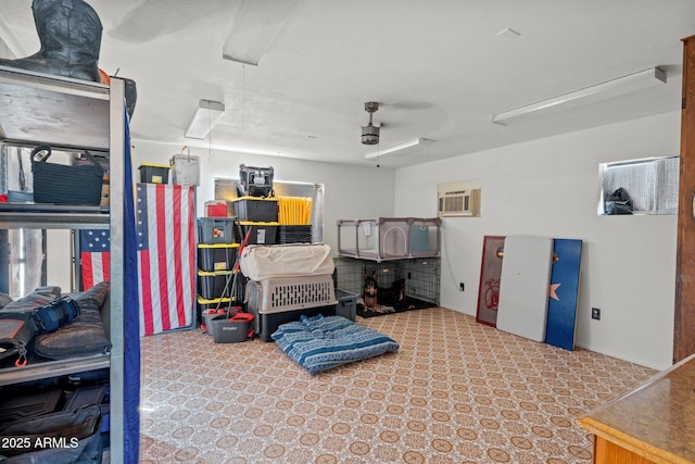 665 W Chaparral Rd, Wickenburg, AZ 85390 - miscellaneous room featuring attic access, a garage, and an AC wall unit