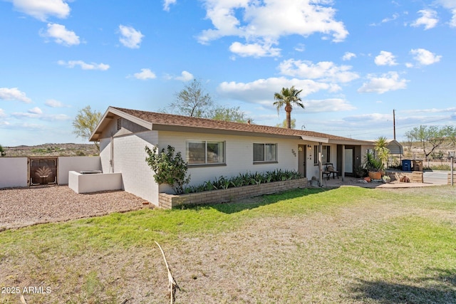 665 W Chaparral Rd, Wickenburg, AZ 85390 - back of property featuring a patio and brick siding