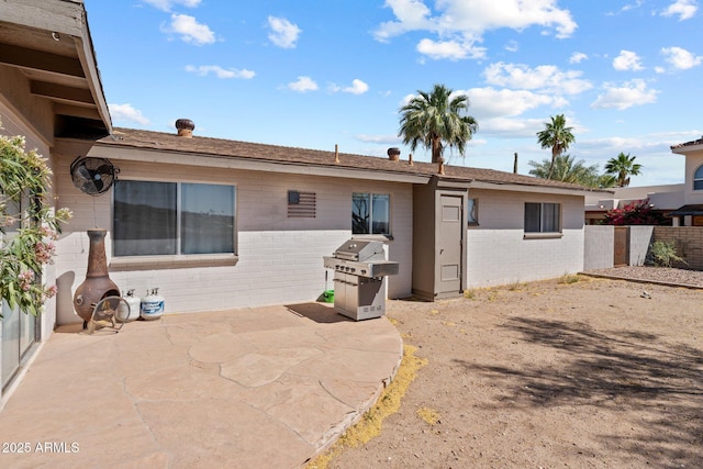 665 W Chaparral Rd, Wickenburg, AZ 85390 - rear view of house with a patio area and brick siding