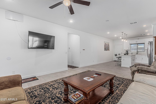 32102 N Walnut St, Wittmann, AZ 85361 - living area featuring a ceiling fan, recessed lighting, baseboards, and light tile patterned flooring