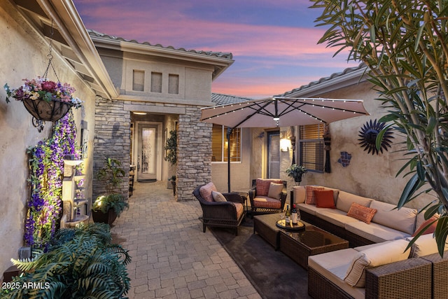 patio terrace at dusk with outdoor lounge area