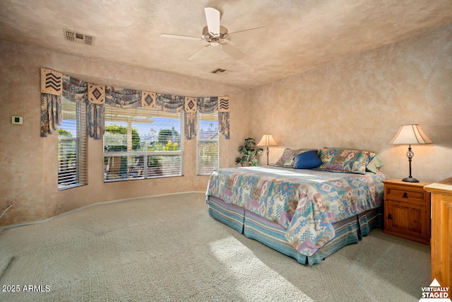 carpeted bedroom featuring ceiling fan