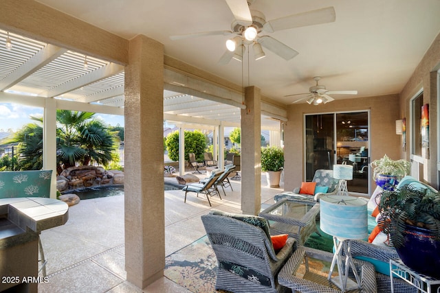 view of patio with ceiling fan and a pergola