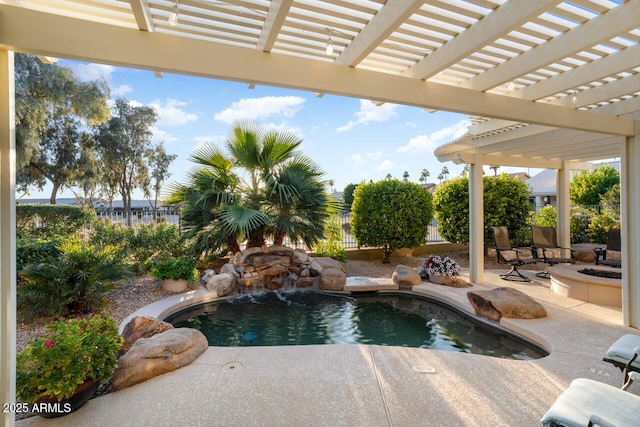 view of pool featuring a patio, pool water feature, and a pergola