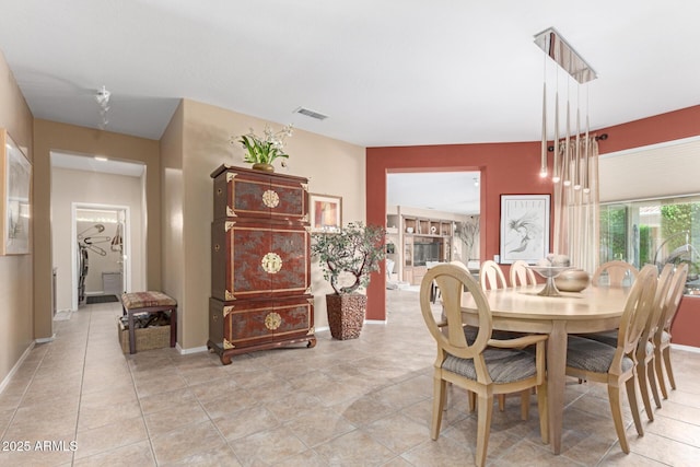 dining room with visible vents and baseboards