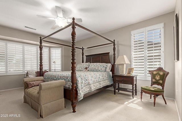 bedroom with visible vents, baseboards, and multiple windows