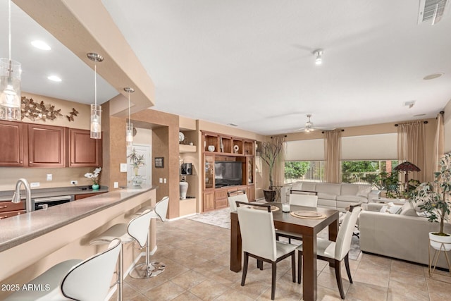 dining area with light tile patterned floors, a ceiling fan, recessed lighting, and visible vents