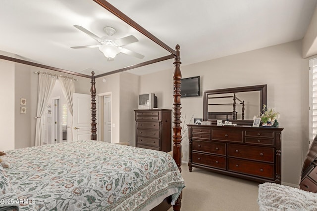 bedroom with ceiling fan and light colored carpet