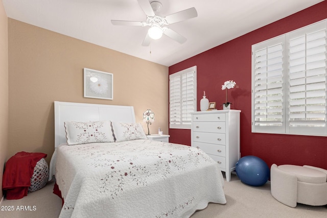 carpeted bedroom featuring ceiling fan