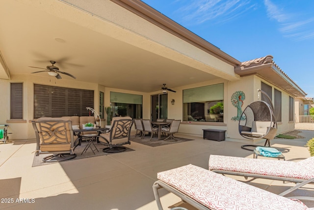 view of patio featuring outdoor dining area, ceiling fan, and an outdoor living space