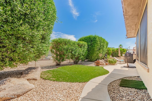 view of yard featuring fence and a patio area