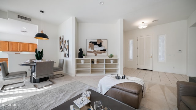 living room featuring light colored carpet