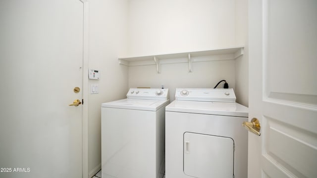 laundry room featuring washing machine and dryer