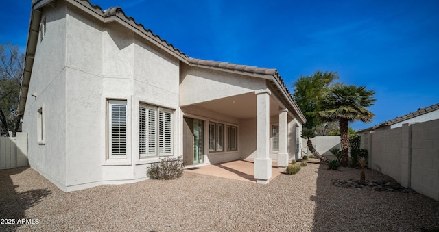 back of house with a patio area