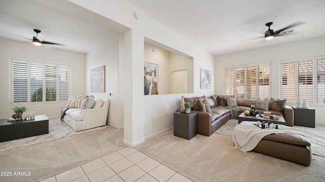 living room featuring light carpet and ceiling fan