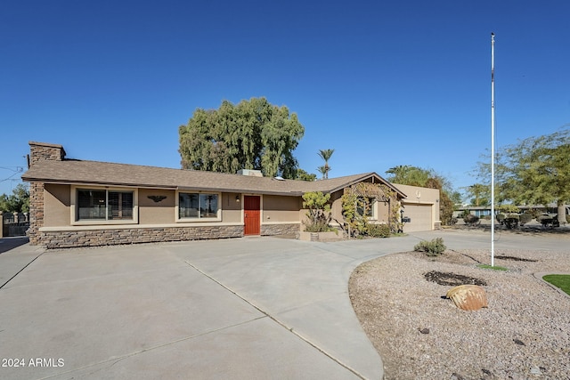 ranch-style home featuring a garage