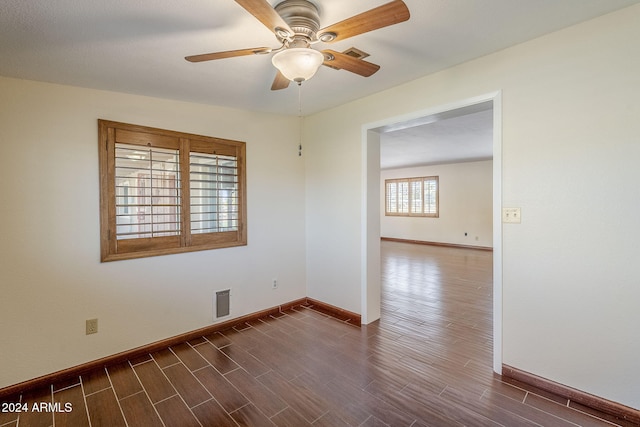 unfurnished room with ceiling fan